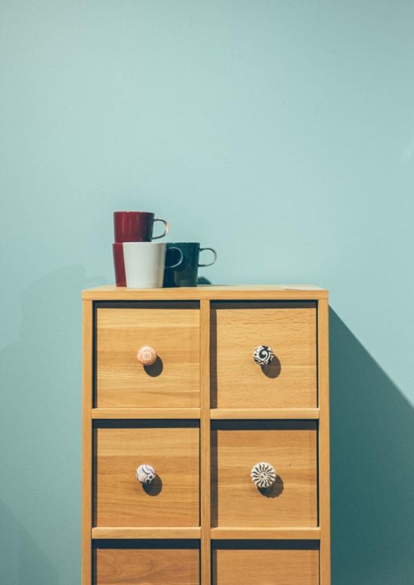 Cups and green wall